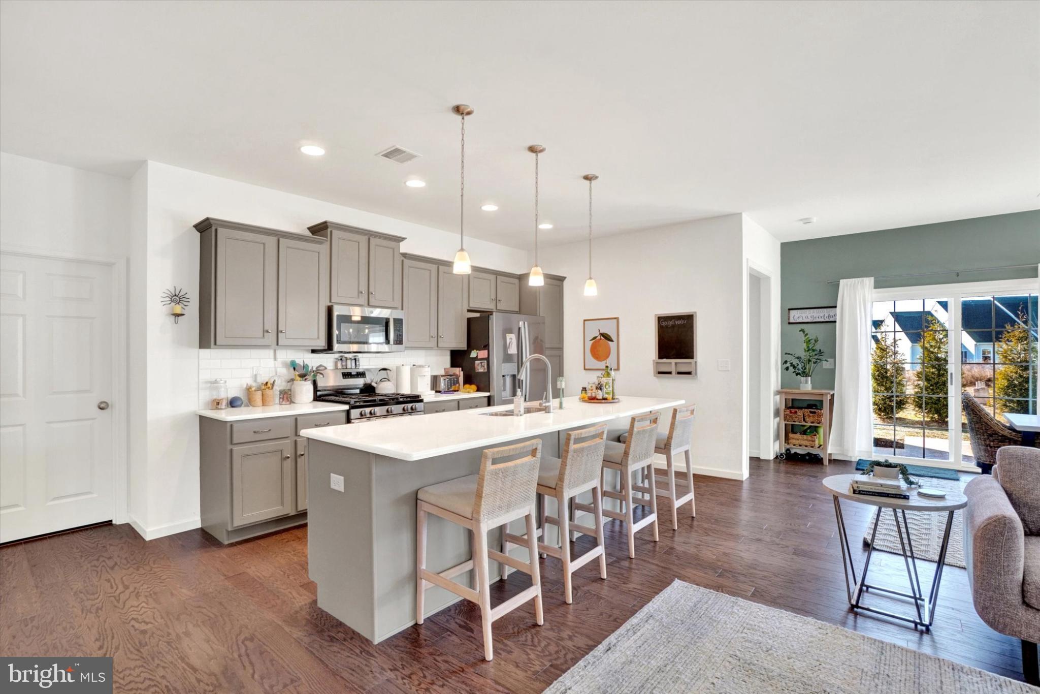 922 Shadowbrooke Dover, PA 17315 - Photo 4 of 25 a kitchen with appliances a sink a counter top space and a center island