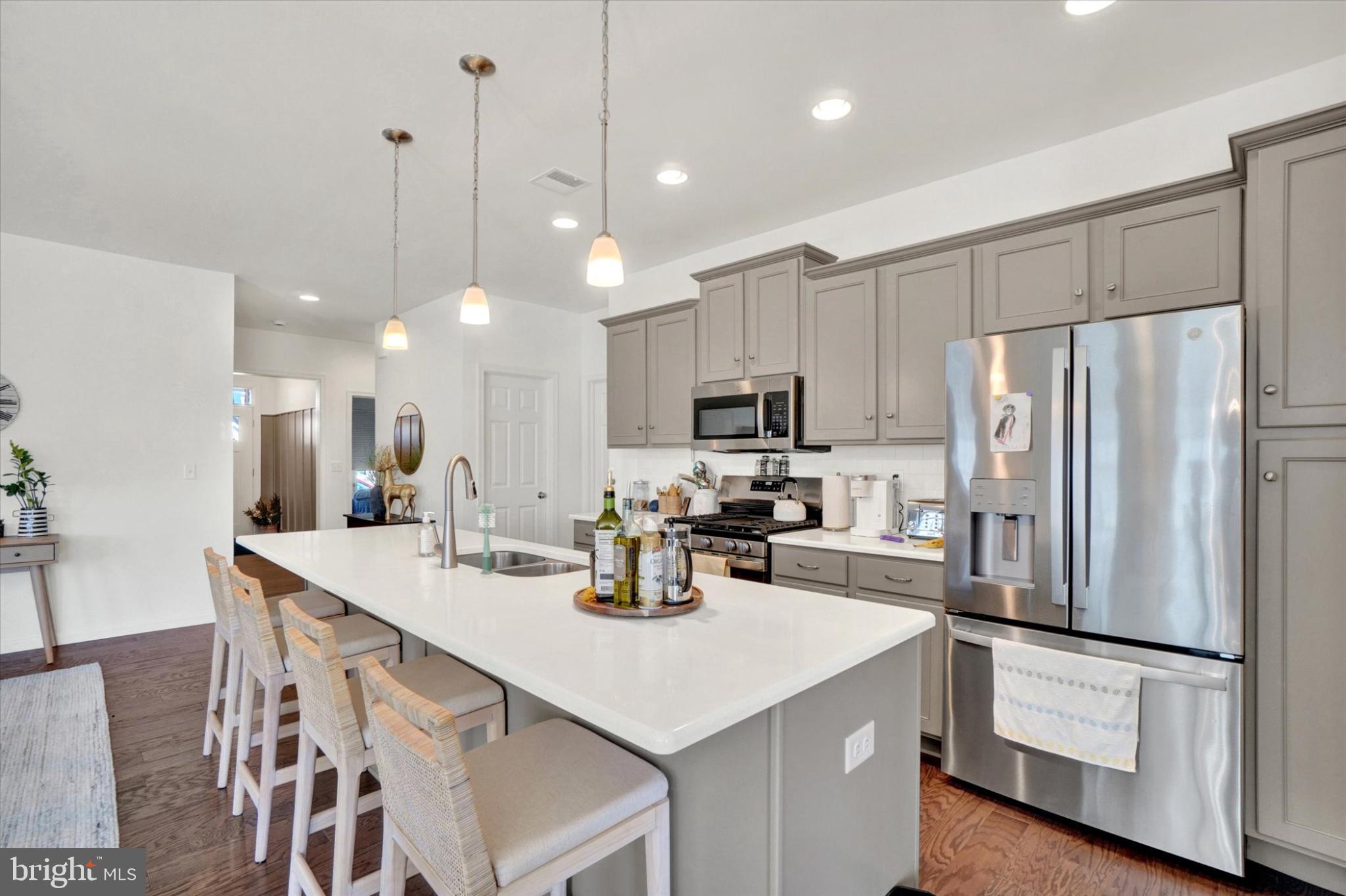 922 Shadowbrooke Dover, PA 17315 - Photo 7 of 25 a kitchen with white cabinets and stainless steel appliances