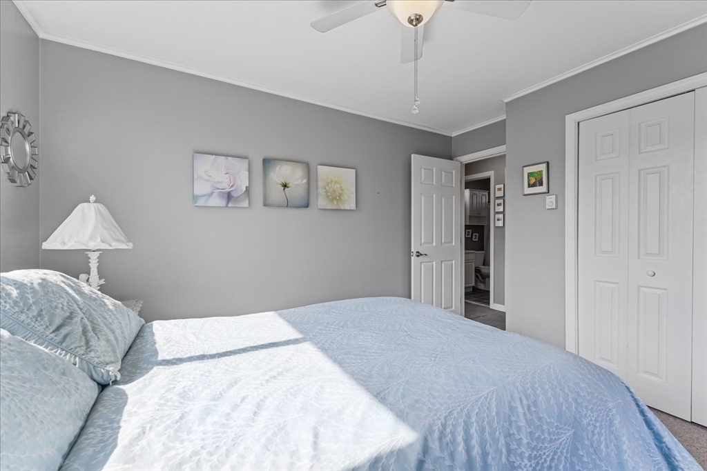 45 Tupelo Road South Kingstown, RI 02879 - Photo 11 of 28 a bedroom with a bed and a window