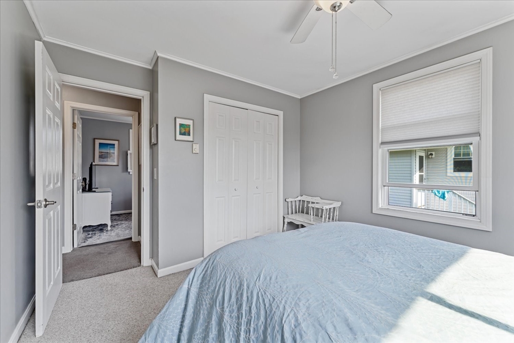 45 Tupelo Road South Kingstown, RI 02879 - Photo 12 of 28 a bedroom with a bed and a window