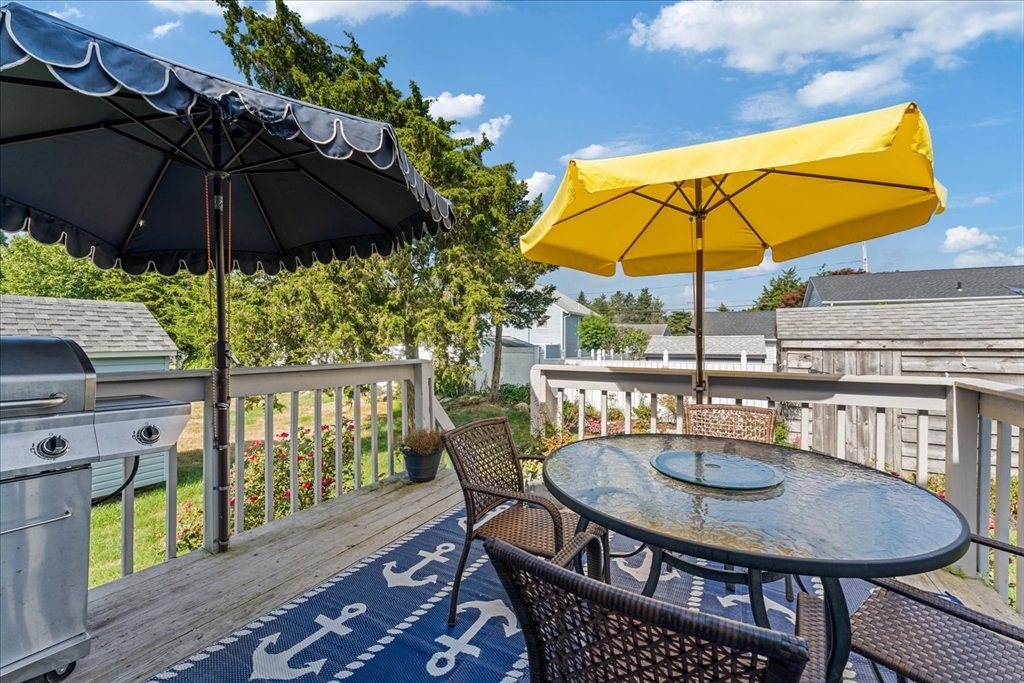 45 Tupelo Road South Kingstown, RI 02879 - Photo 22 of 28 a table and chairs in the balcony