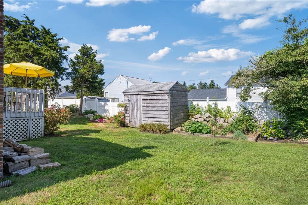 45 Tupelo Road South Kingstown, RI 02879 - Photo 23 of 28 a view of a house with a yard and sitting area