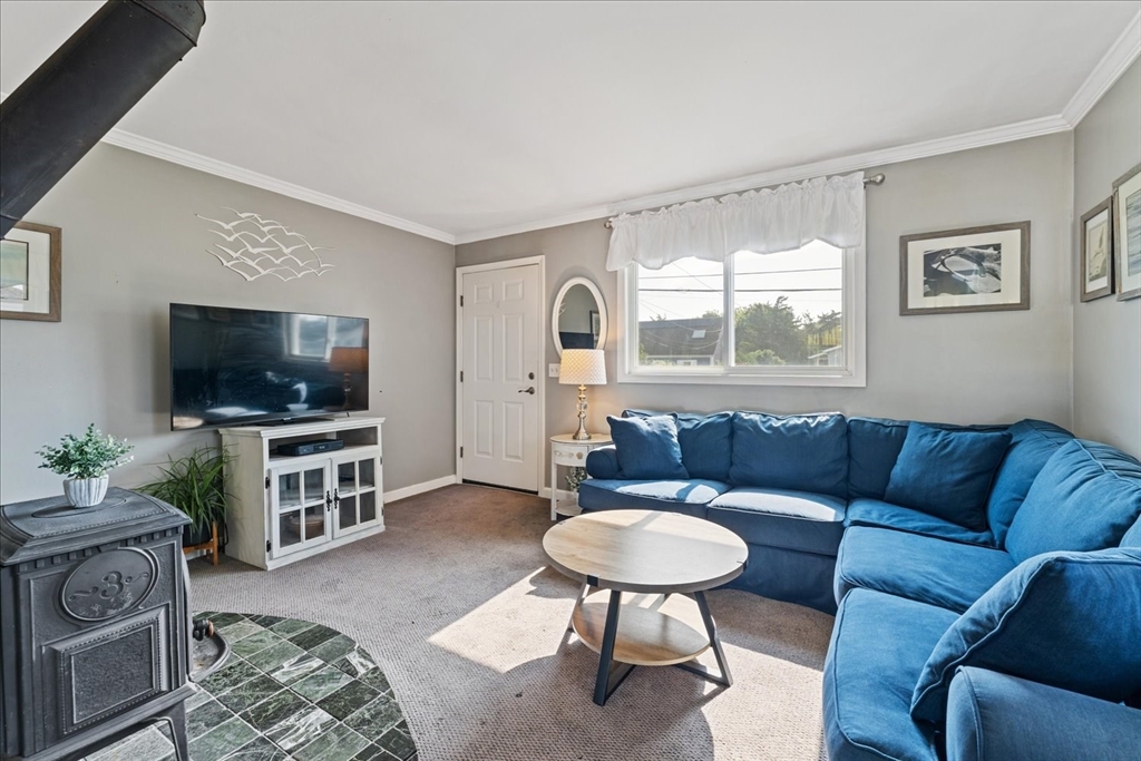 45 Tupelo Road South Kingstown, RI 02879 - Photo 6 of 28 a living room with furniture and a flat screen tv