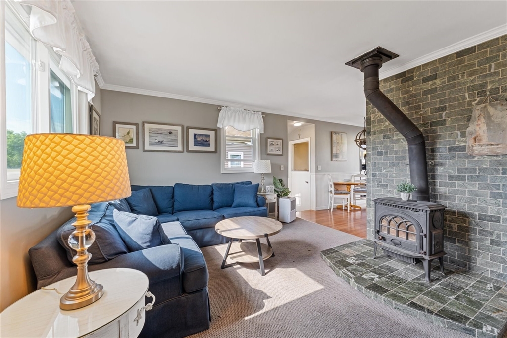 45 Tupelo Road South Kingstown, RI 02879 - Photo 7 of 28 a living room with furniture and a fireplace