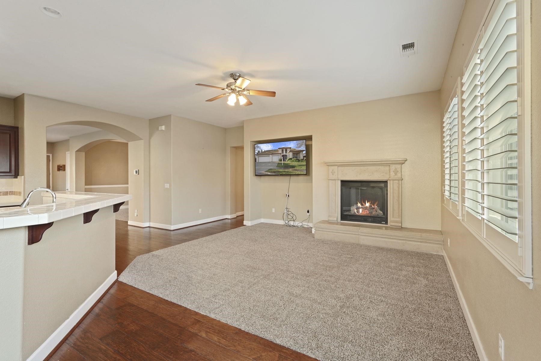 2644 Swainsons Hawk Street Stockton, CA 95209 - Photo 13 of 41 a view of empty room with a fireplace and fan