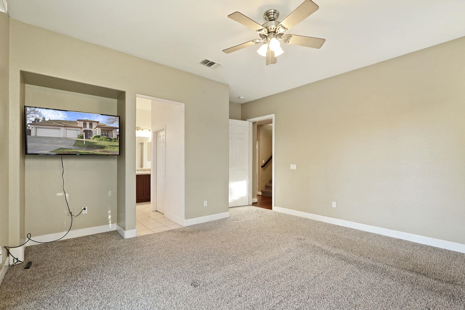2644 Swainsons Hawk Street Stockton, CA 95209 - Photo 19 of 41 a view of a livingroom with a chandelier fan