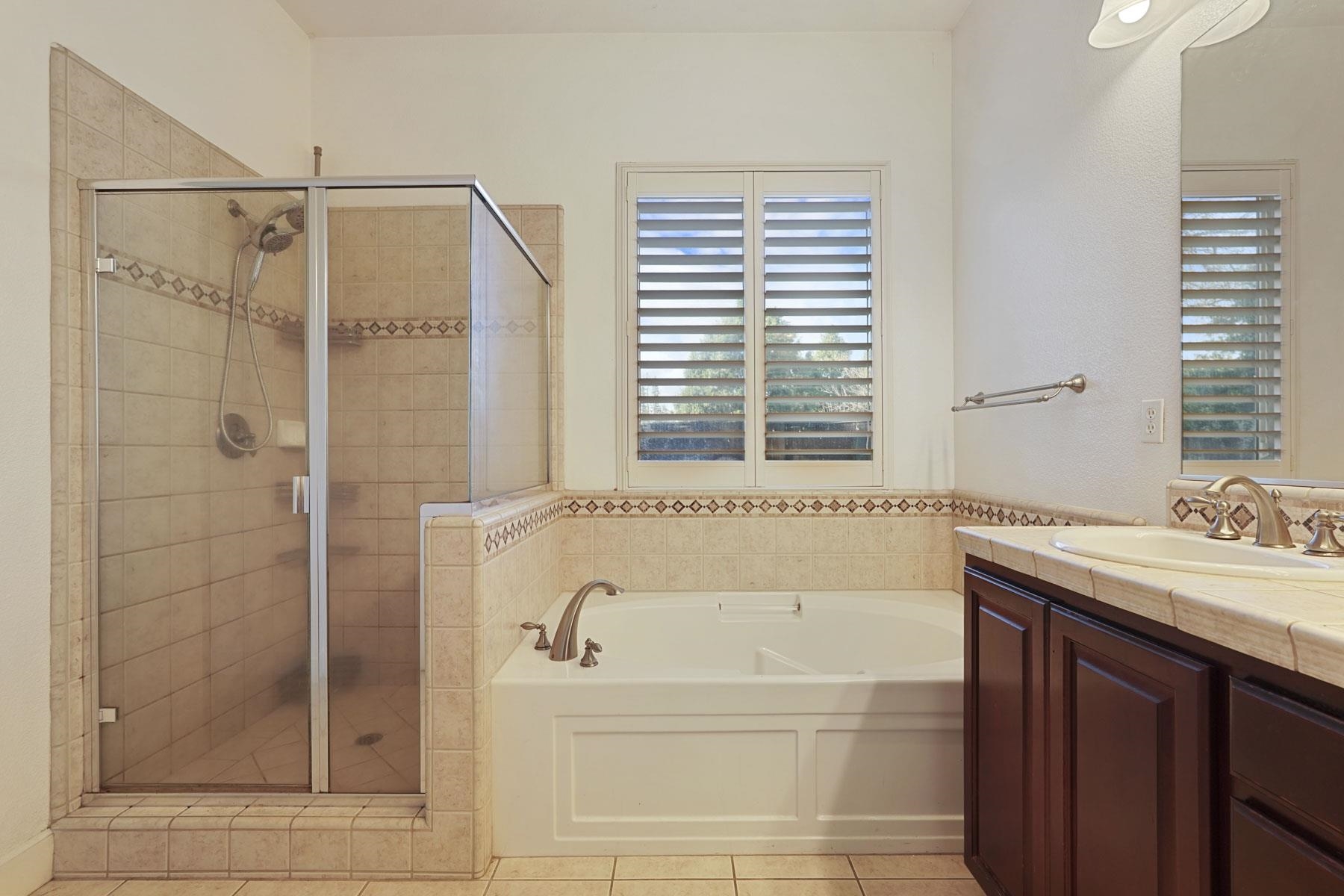 2644 Swainsons Hawk Street Stockton, CA 95209 - Photo 22 of 41 a bathroom with a shower and a bathtub