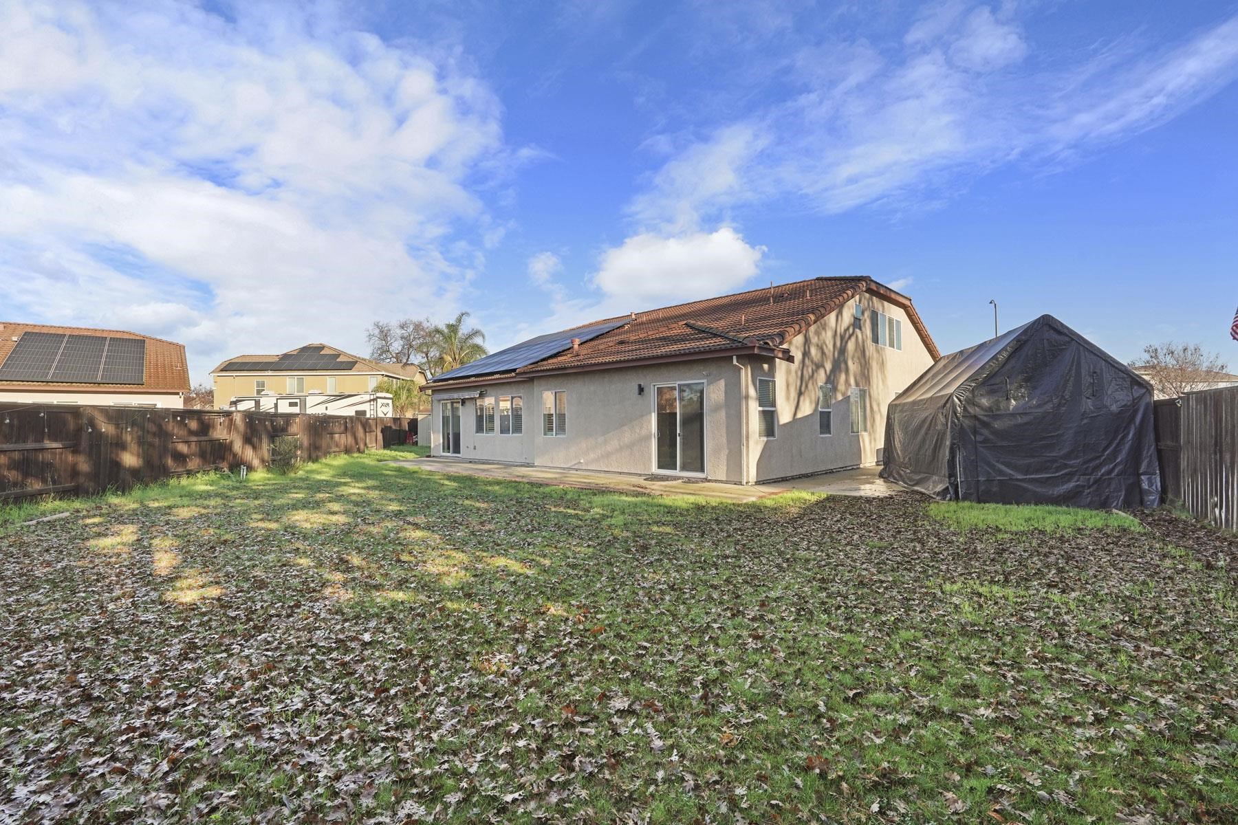 2644 Swainsons Hawk Street Stockton, CA 95209 - Photo 36 of 41 a view of a house with a yard