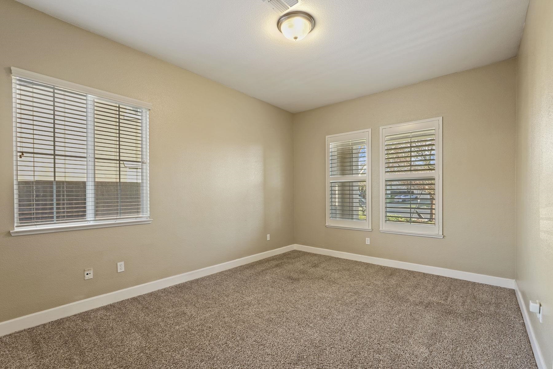 2644 Swainsons Hawk Street Stockton, CA 95209 - Photo 7 of 41 a view of an empty room with a window