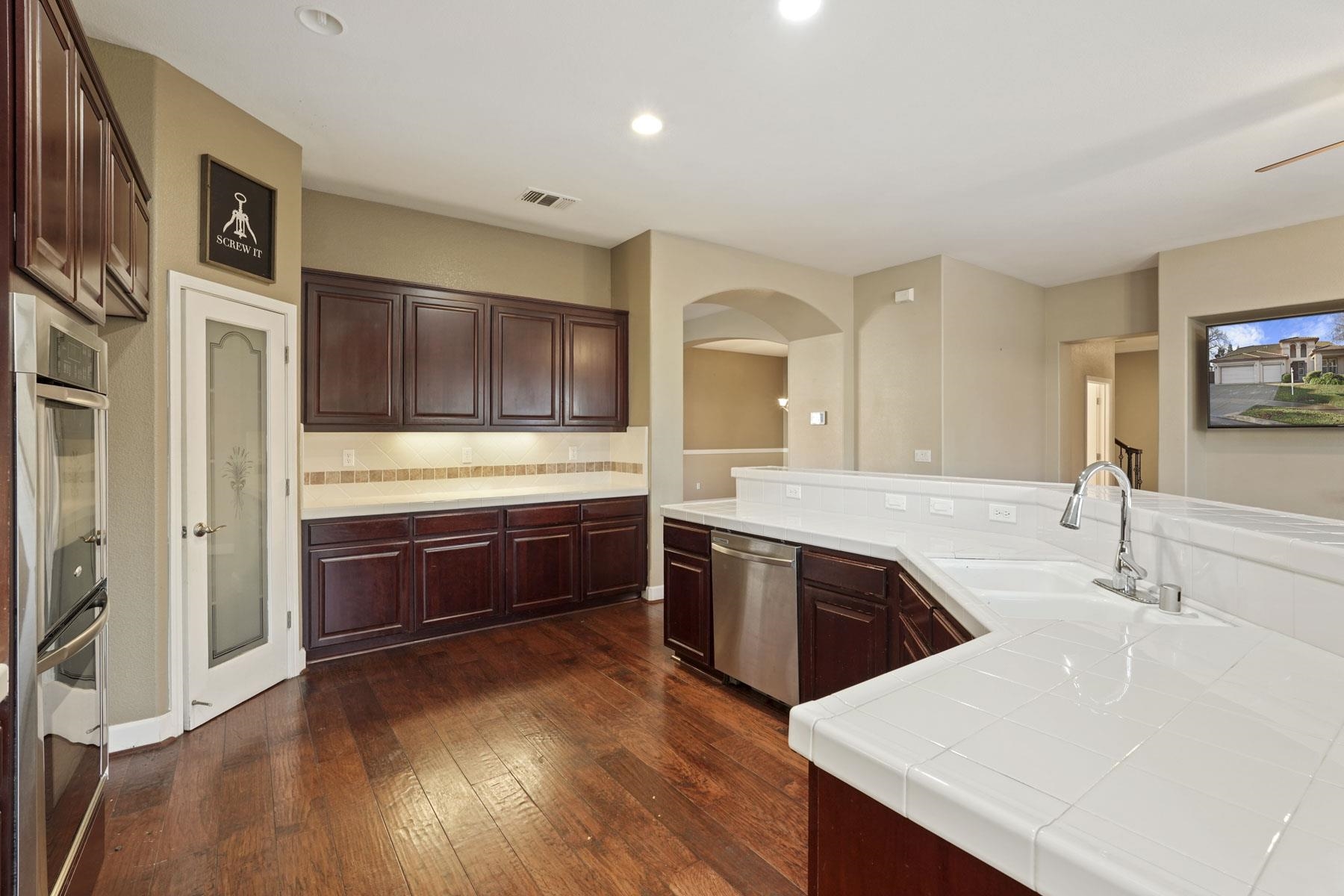 2644 Swainsons Hawk Street Stockton, CA 95209 - Photo 10 of 41 a large kitchen with stainless steel appliances and a sink