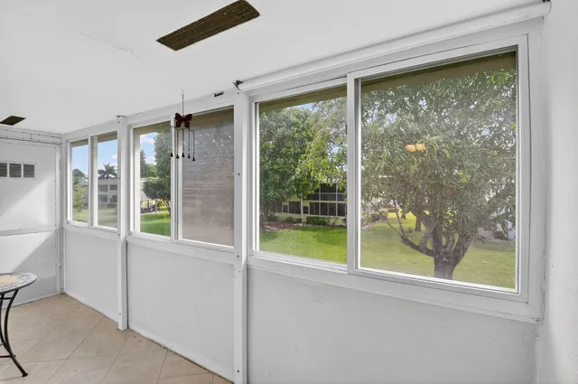 a view of a room that has a large window