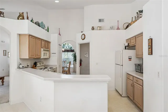 a kitchen with stainless steel appliances a refrigerator and a sink