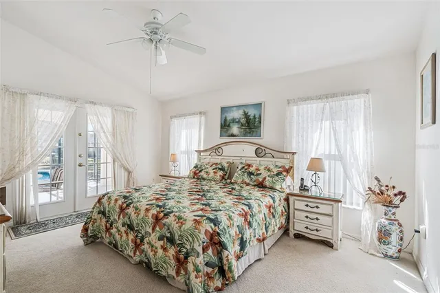 a bed room with a bed and a chair