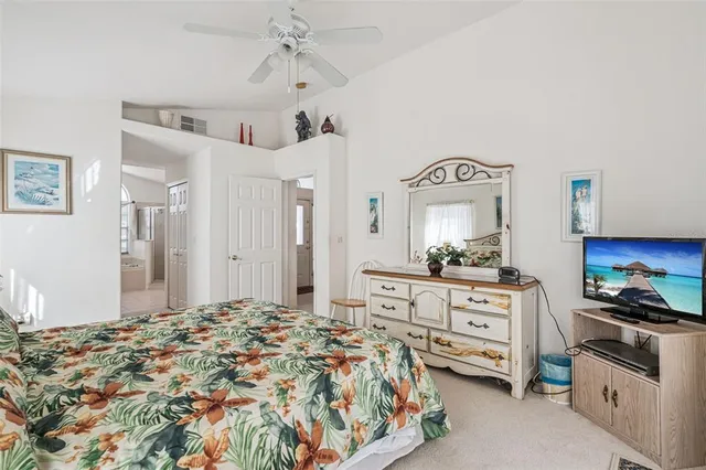 a bathroom with a tub a sink and a mirror