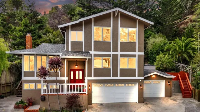 a front view of a house with a yard