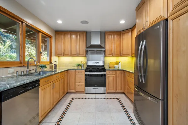 a view of entryway with wooden floor and stairs