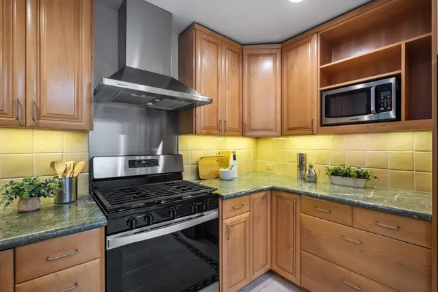 a spacious bedroom with a bed and glass wall