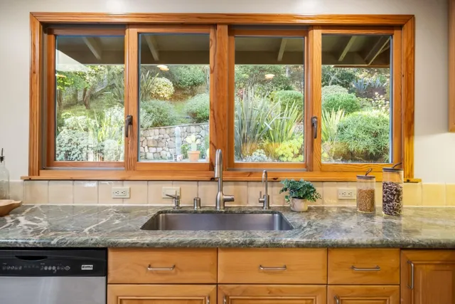 a spacious bathroom with a tub sink and mirror