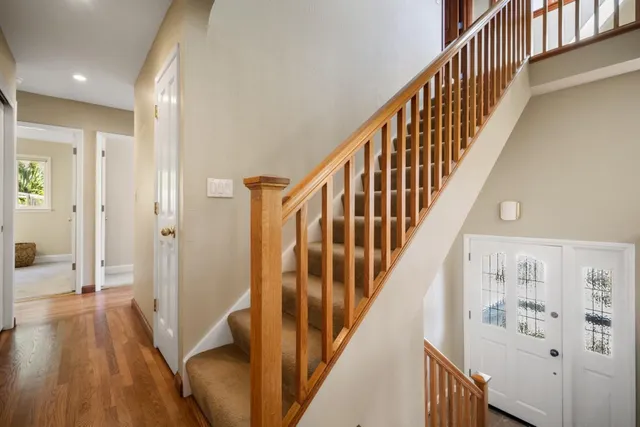 a view of a swimming pool with a patio and a yard