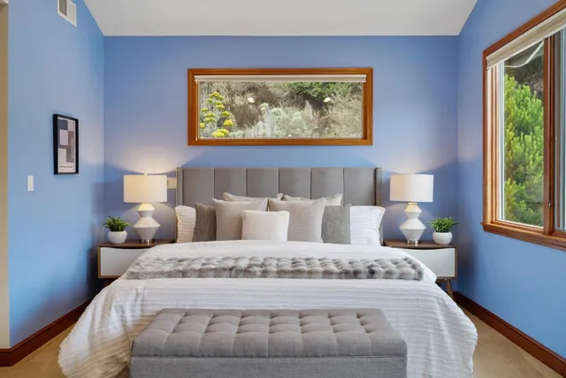 a view of a house with backyard and wooden floor