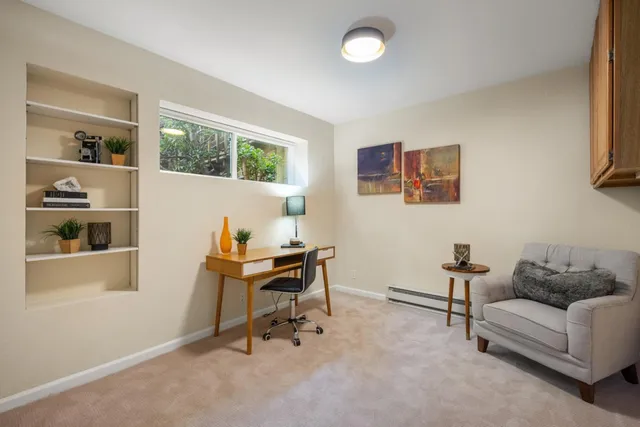 a aerial view of a house with a yard and potted plants