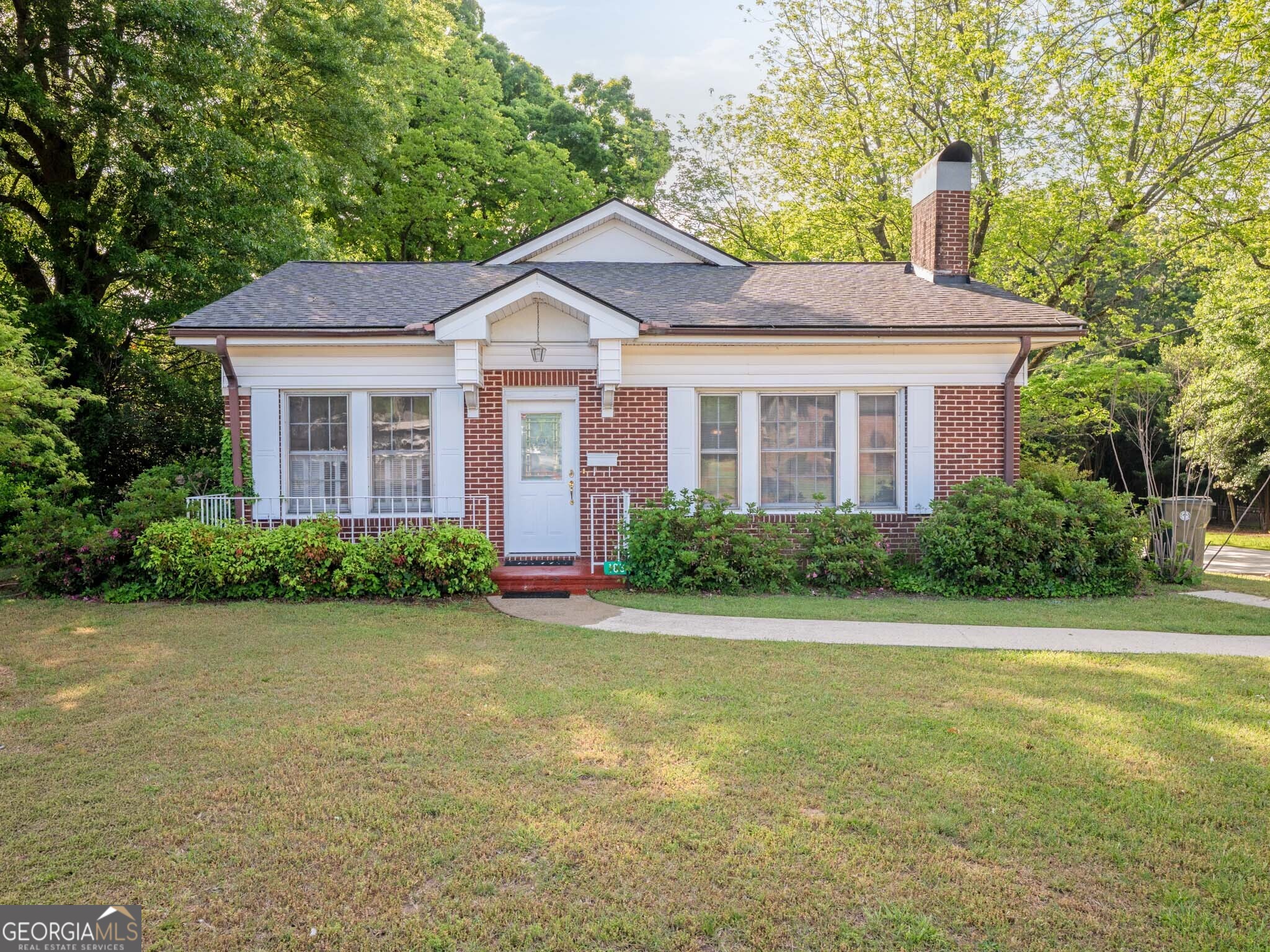 183 Athens Street Hartwell, GA 30643 - Photo 1 of 19 a front view of a house with garden