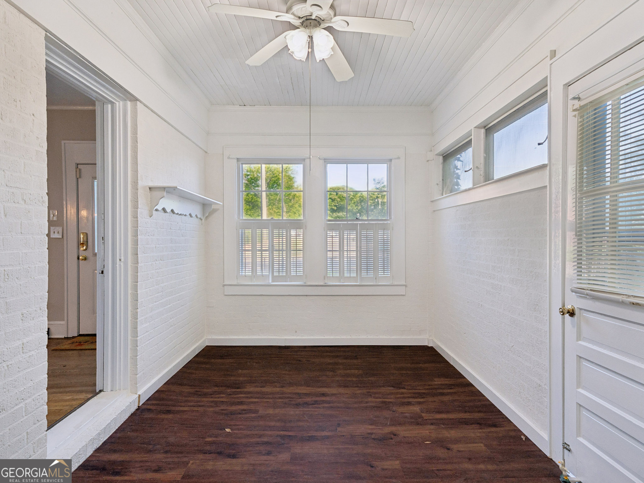 183 Athens Street Hartwell, GA 30643 - Photo 12 of 19 a view of an empty room with wooden floor and a window