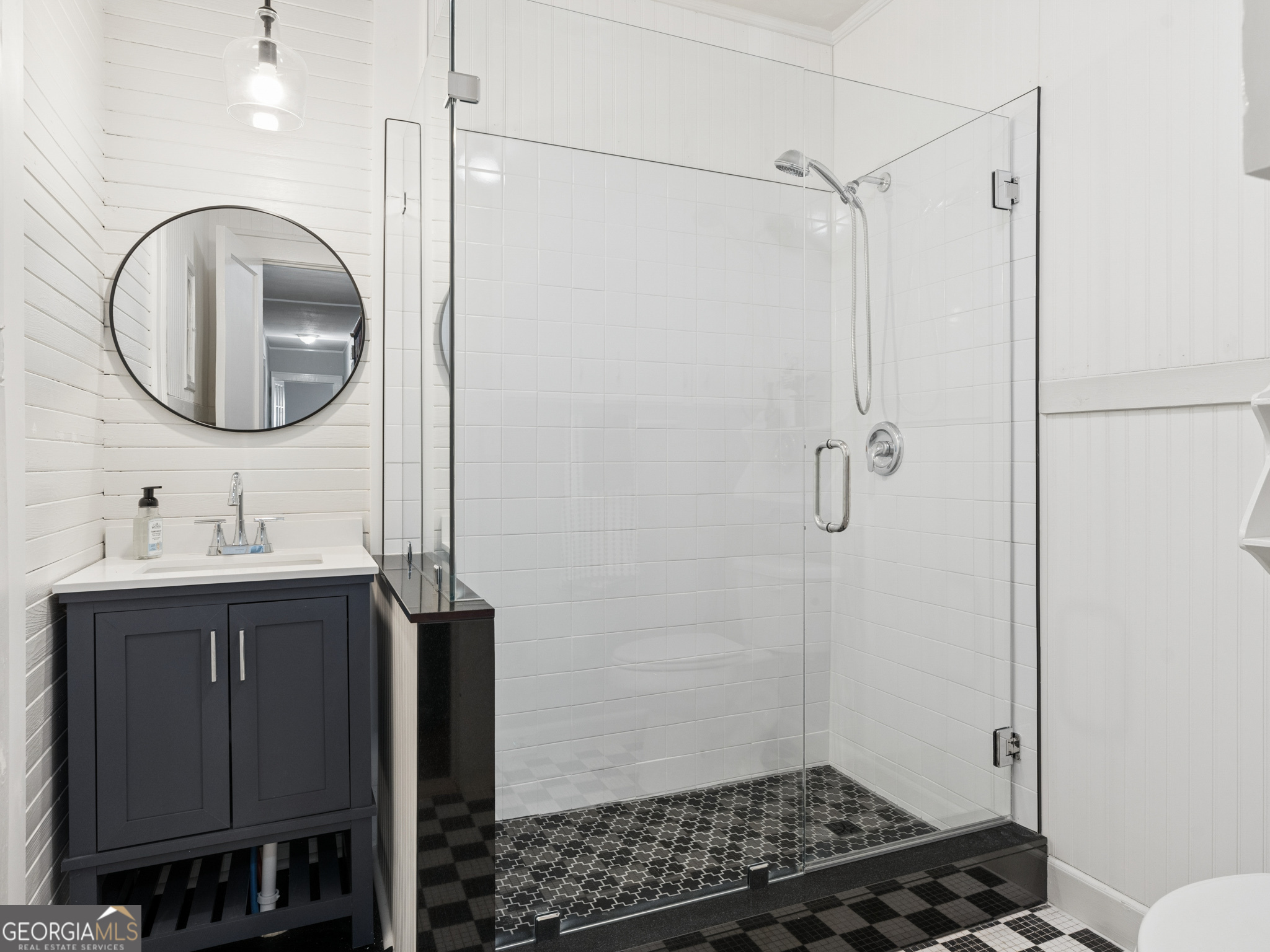 183 Athens Street Hartwell, GA 30643 - Photo 5 of 19 a bathroom with a sink a toilet a mirror and shower
