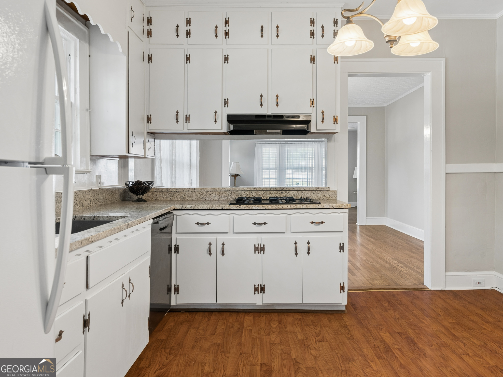 183 Athens Street Hartwell, GA 30643 - Photo 6 of 19 a view of kitchen with granite countertop white cabinets and stainless steel appliances