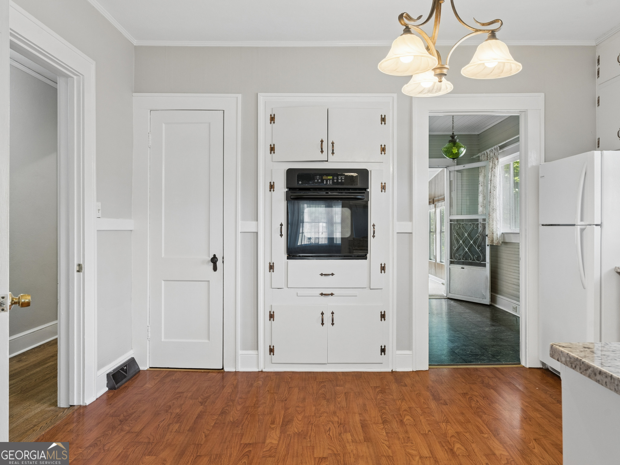 183 Athens Street Hartwell, GA 30643 - Photo 8 of 19 a living room with stainless steel appliances kitchen island granite countertop furniture and a fireplace
