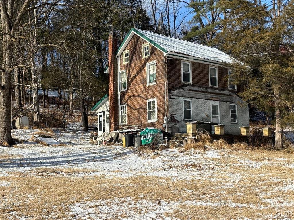 899 Browntown Road Nazareth, PA 18064 - Photo 1 of 10 a view of a house with a yard covered in snow