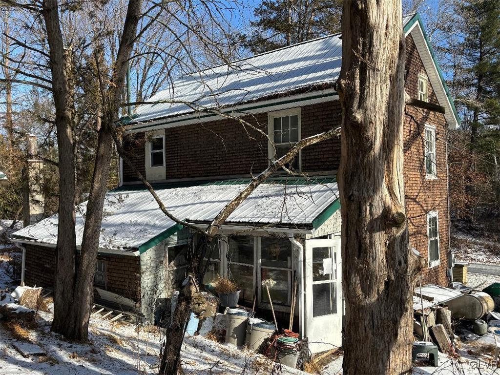 899 Browntown Road Nazareth, PA 18064 - Photo 2 of 10 a view of a house with a tree beside it
