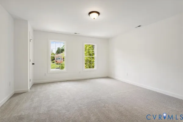 an empty room with windows