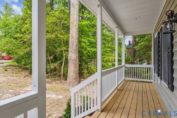 a view of balcony with wooden floor