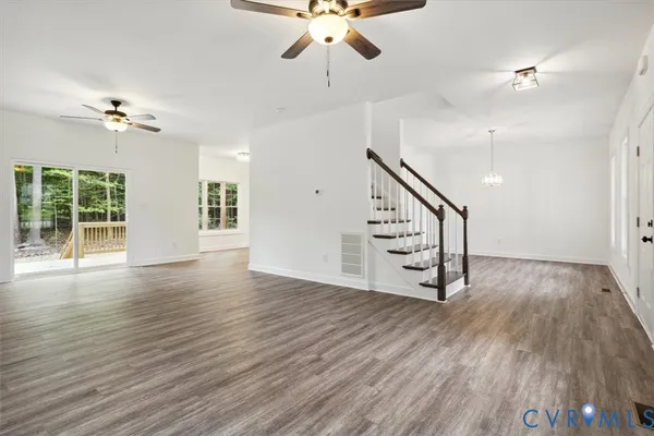 a view of an entryway with wooden floor