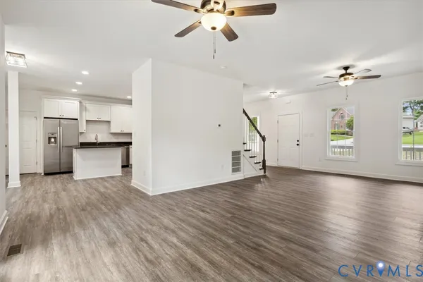 a view of a kitchen with a sink and a window