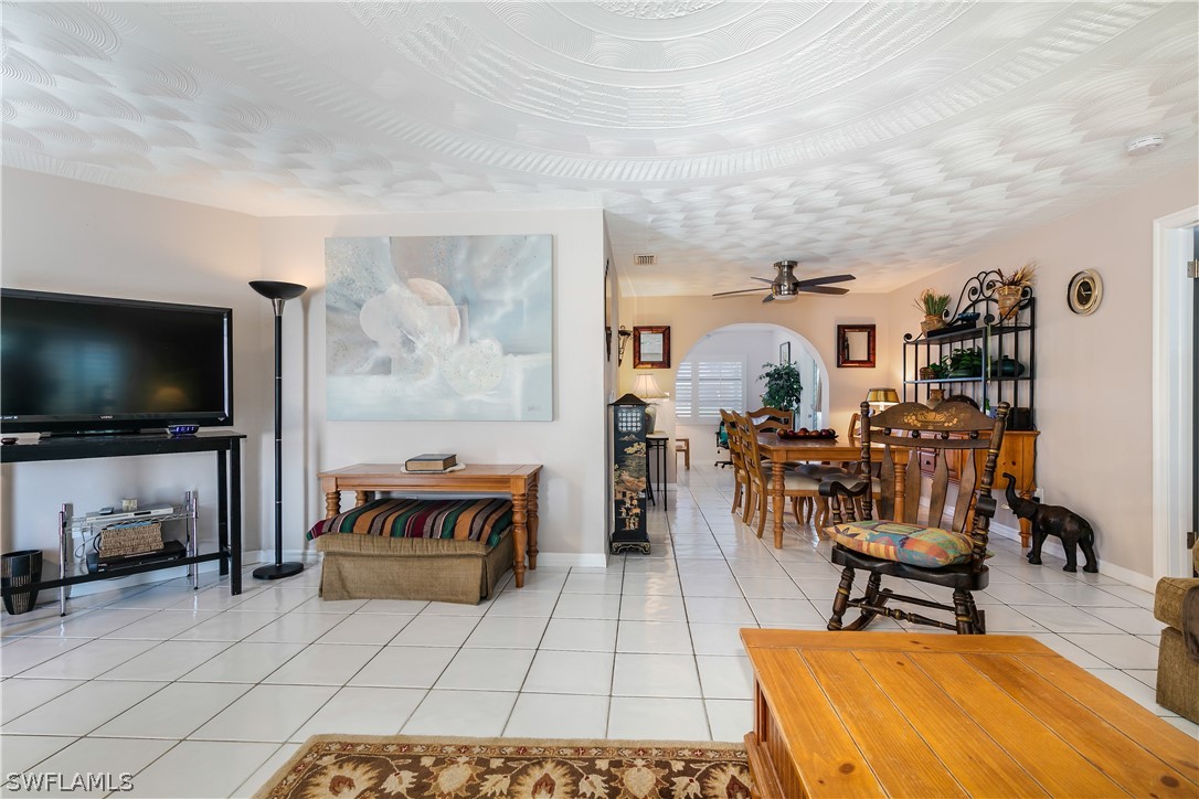 7635 Laurel Valley Road Fort Myers, FL 33967 - Photo 11 of 30 a living room with furniture and a flat screen tv