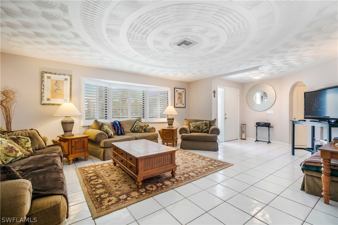 7635 Laurel Valley Road Fort Myers, FL 33967 - Photo 9 of 30 a living room with furniture and wooden floor
