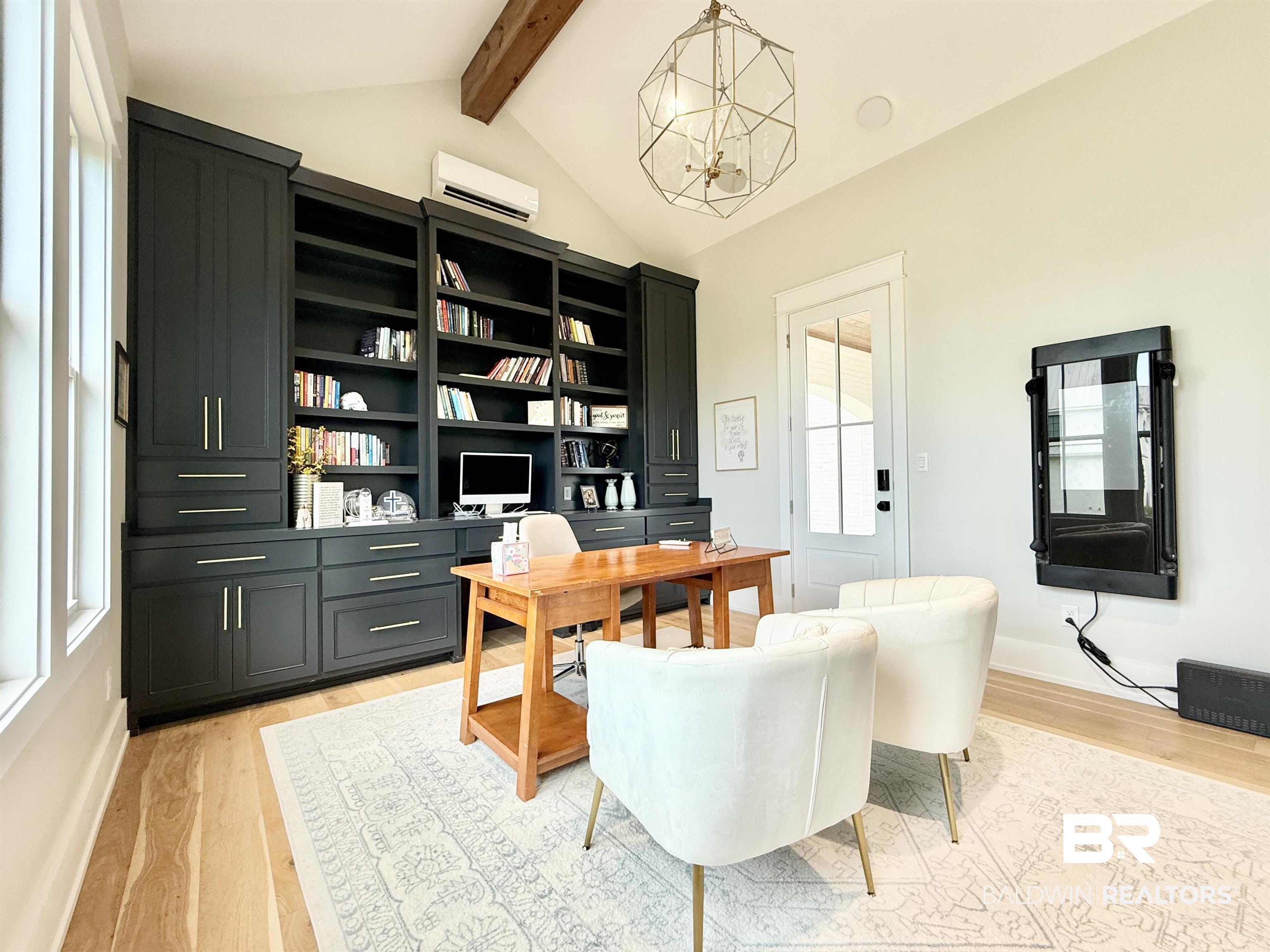 21767 Gallery Boulevard Fairhope, AL 36532 - Photo 54 of 74 Home office with a chandelier, light wood-style floors, and a wall mounted air conditioner