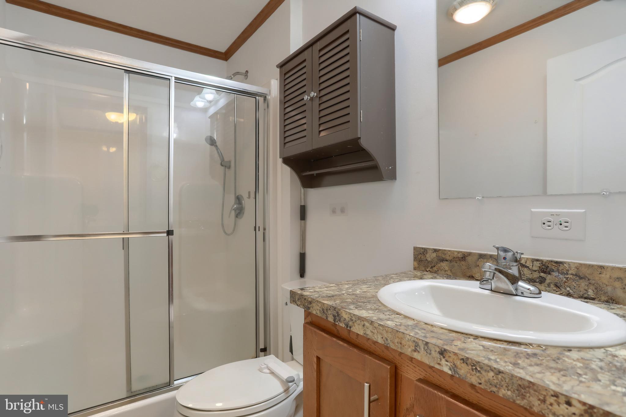 14 Shellie Street Lebanon, PA 17046 - Photo 13 of 19 a bathroom with a granite countertop sink toilet and shower