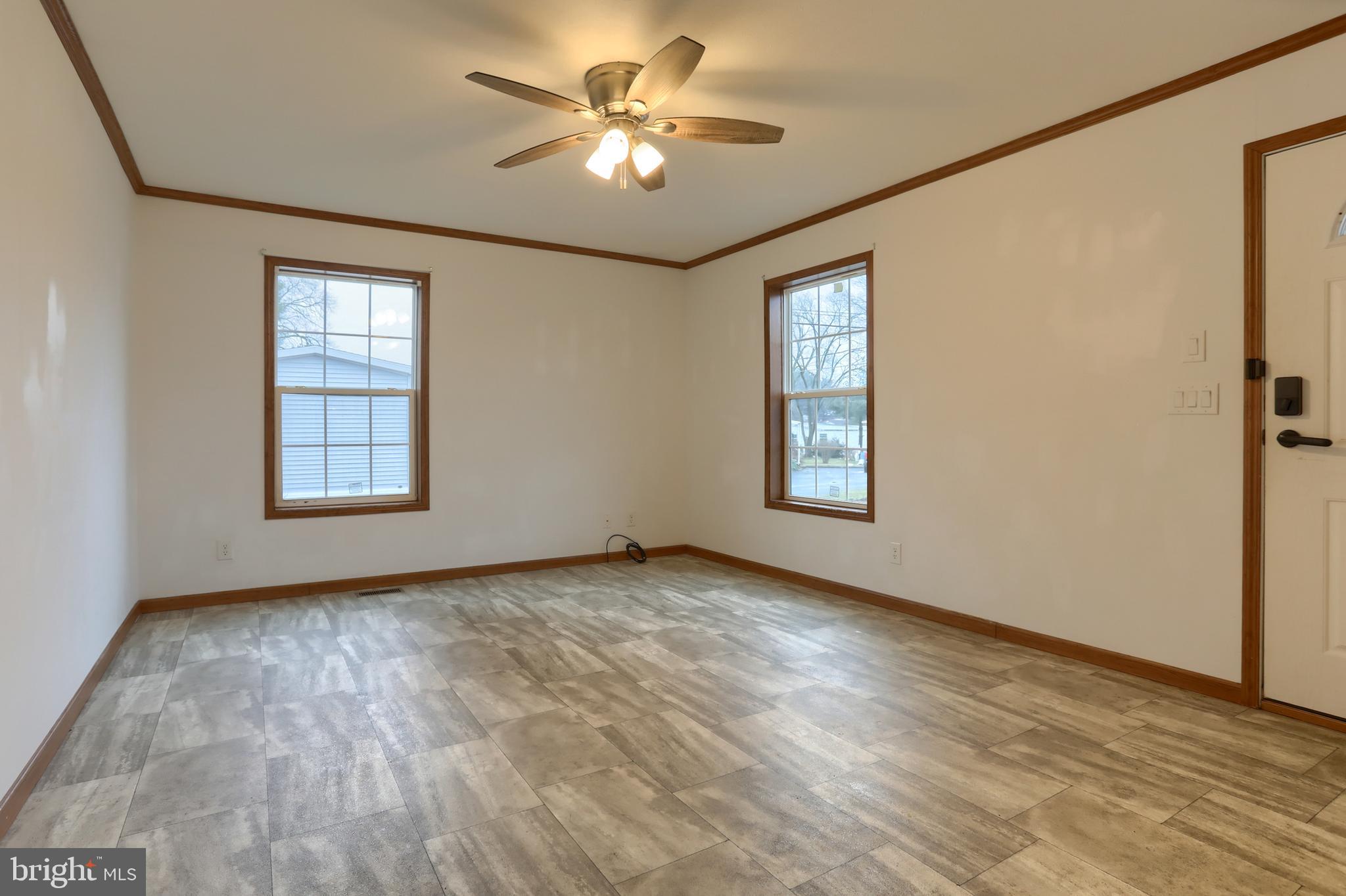 14 Shellie Street Lebanon, PA 17046 - Photo 4 of 19 a view of an empty room with a window and wooden floor