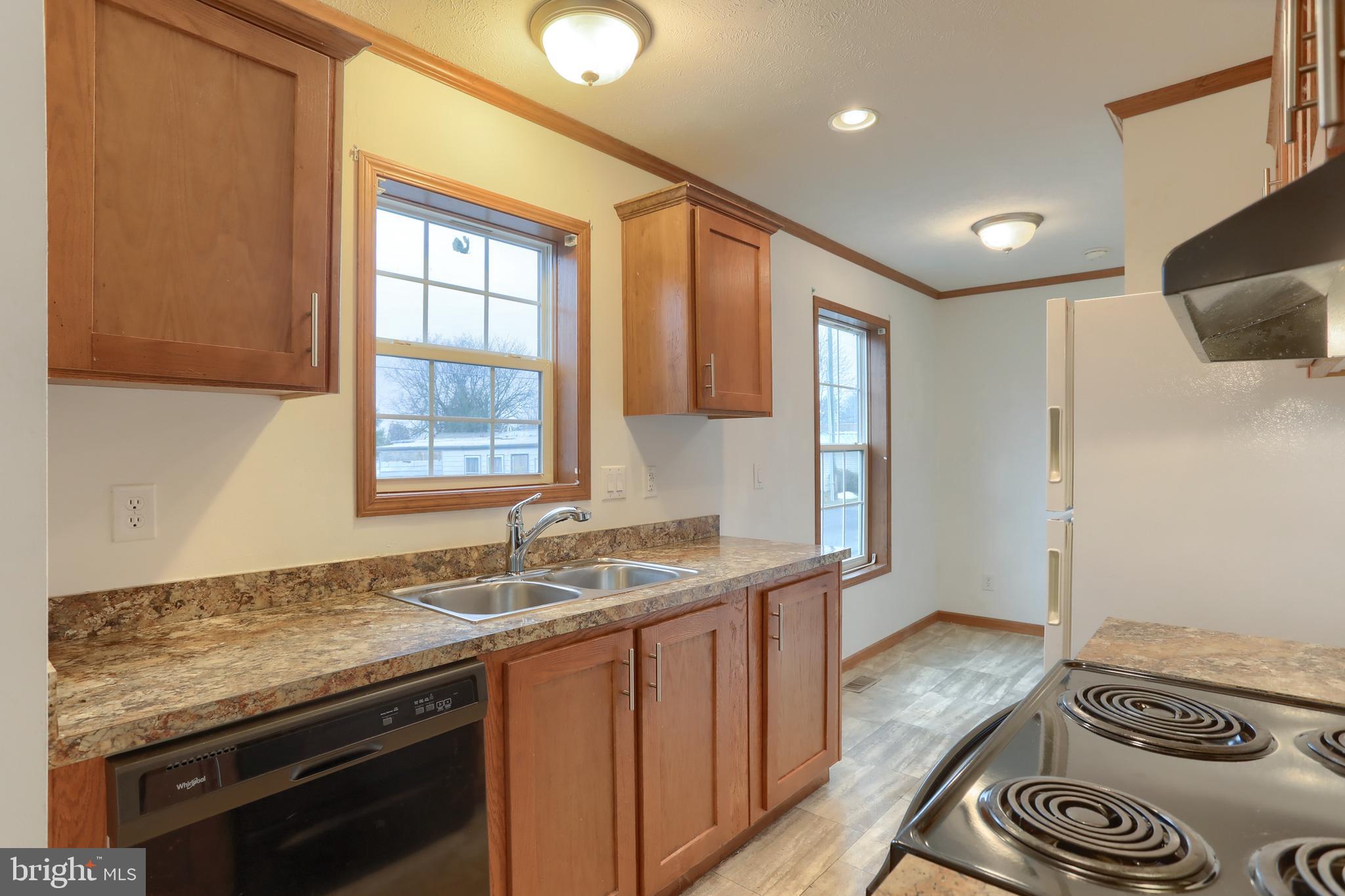 14 Shellie Street Lebanon, PA 17046 - Photo 8 of 19 a kitchen with granite countertop a sink stove and cabinets