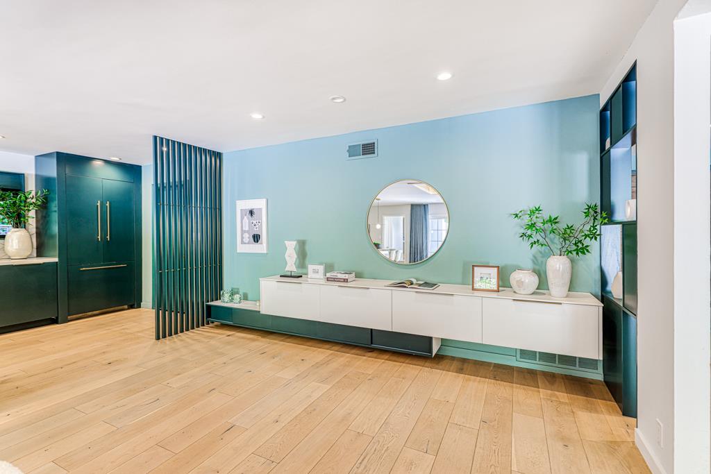 1349 Murchison Drive Millbrae, CA 94030 - Photo 15 of 66 a living room with a mirror and a table