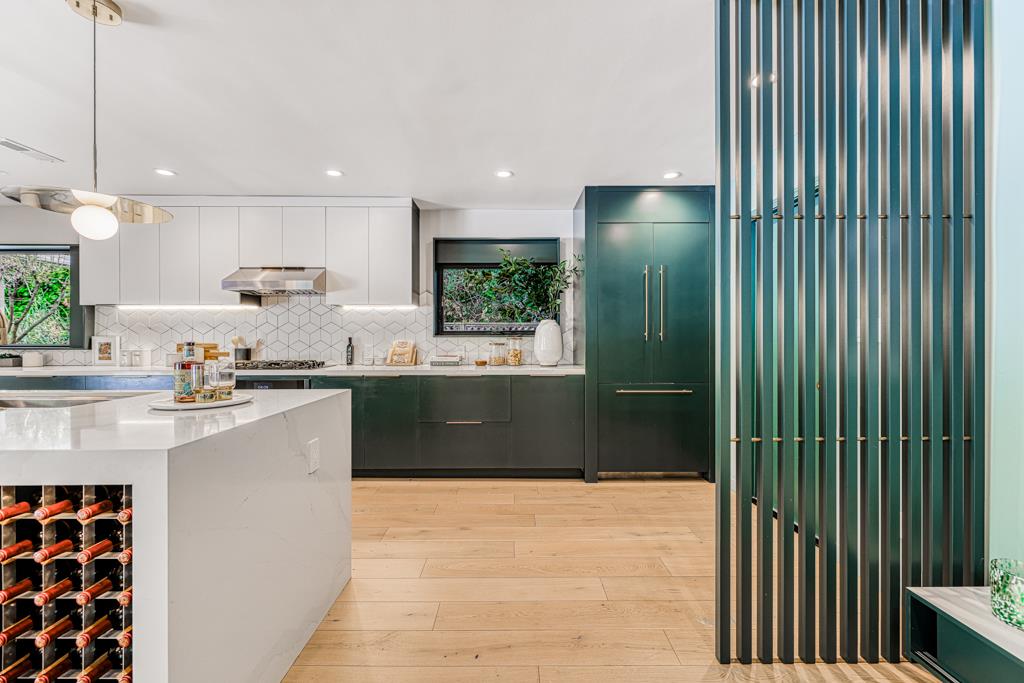 1349 Murchison Drive Millbrae, CA 94030 - Photo 22 of 66 a kitchen with kitchen island a counter top space a sink and appliances