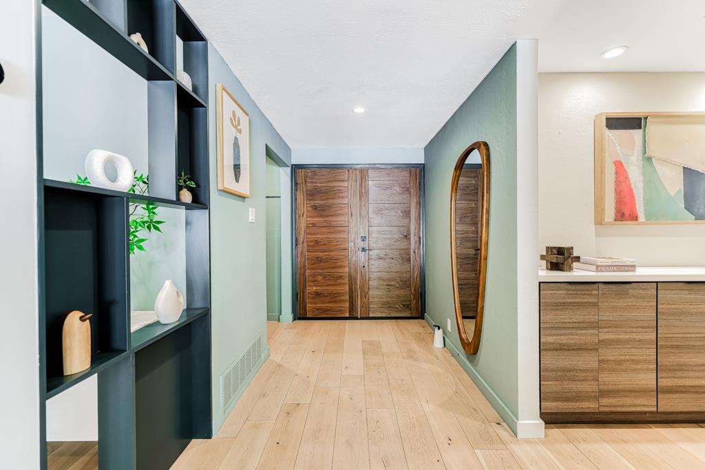 1349 Murchison Drive Millbrae, CA 94030 - Photo 3 of 66 a view of a hallway with entryway bedroom and hall with wooden floor