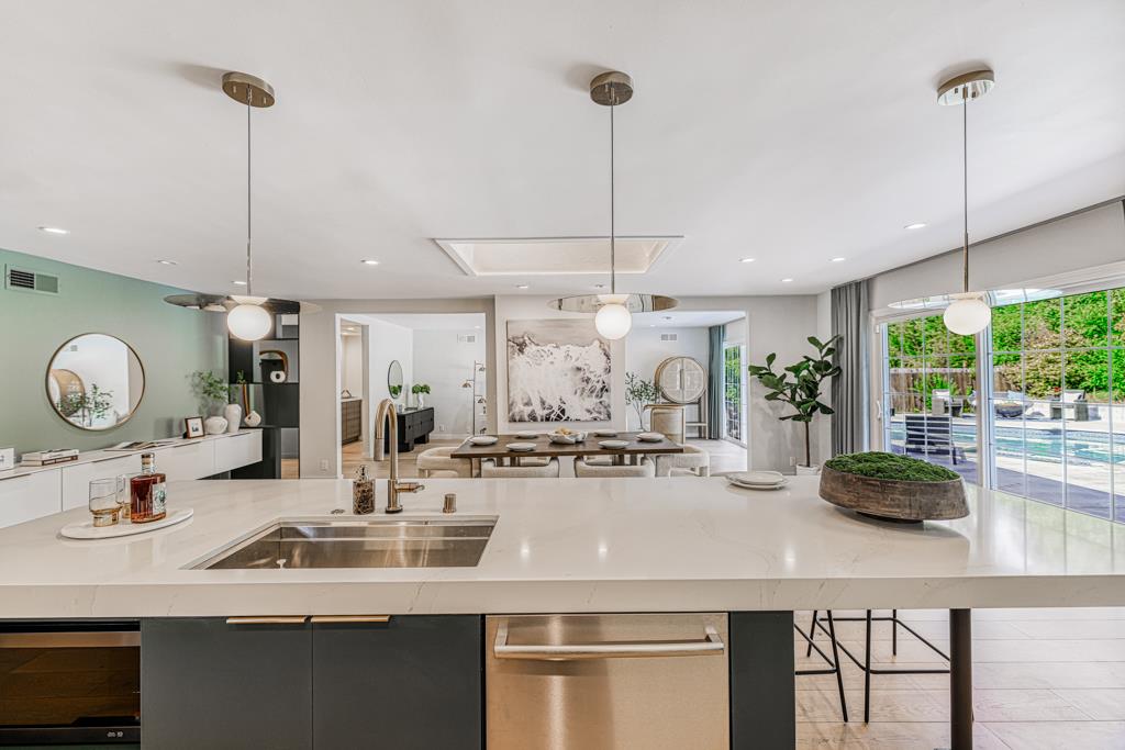 1349 Murchison Drive Millbrae, CA 94030 - Photo 31 of 66 a kitchen with a sink a stove and chairs