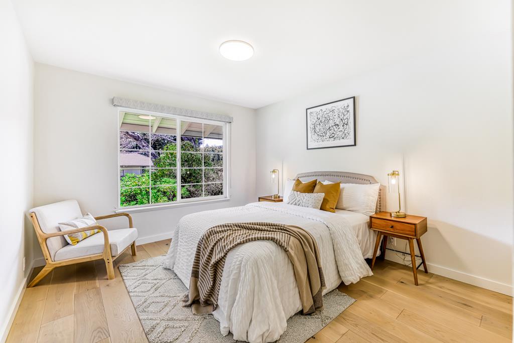 1349 Murchison Drive Millbrae, CA 94030 - Photo 44 of 66 a bed sitting in a bedroom next to a window