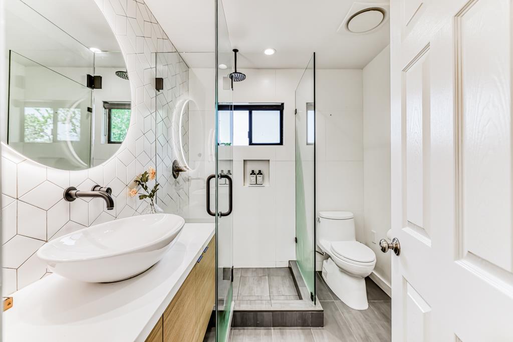 1349 Murchison Drive Millbrae, CA 94030 - Photo 45 of 66 a bathroom with a sink toilet and shower