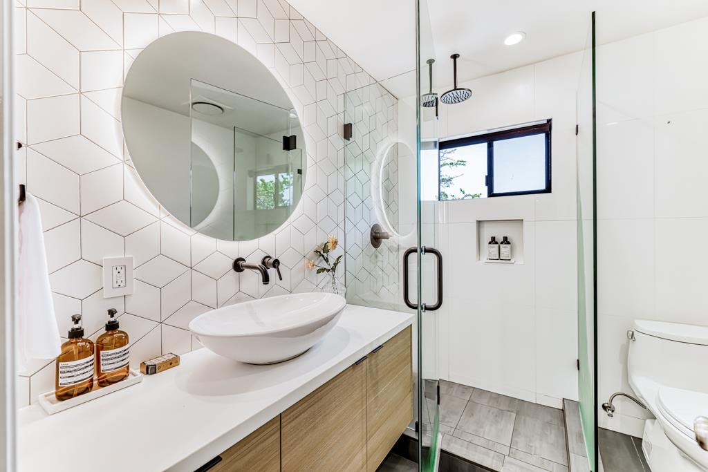 1349 Murchison Drive Millbrae, CA 94030 - Photo 46 of 66 a bathroom with a sink mirror and vanity