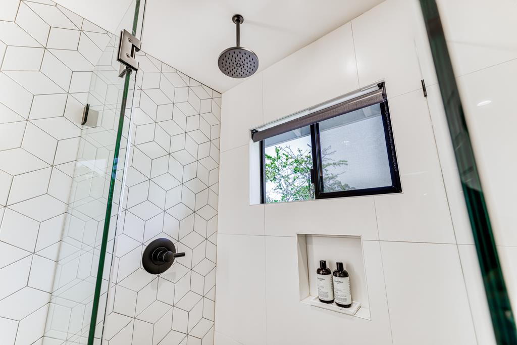 1349 Murchison Drive Millbrae, CA 94030 - Photo 47 of 66 a bathroom with a shower and a window